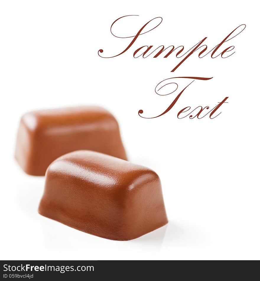 Chocolate Sweets isolated on a white background. Soft Focus. Sample Text. Chocolate Sweets isolated on a white background. Soft Focus. Sample Text.