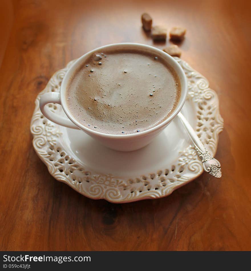 Coffee cup on a wooden background ( close up )