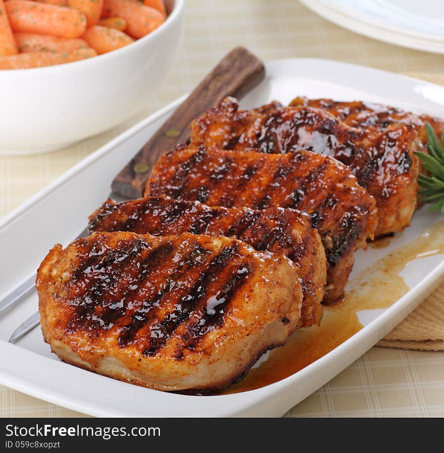 Grilled pork loins on a serving platter