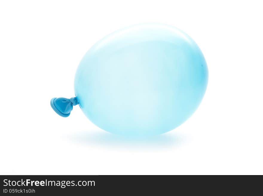 Single blue small balloon macro isolated on white