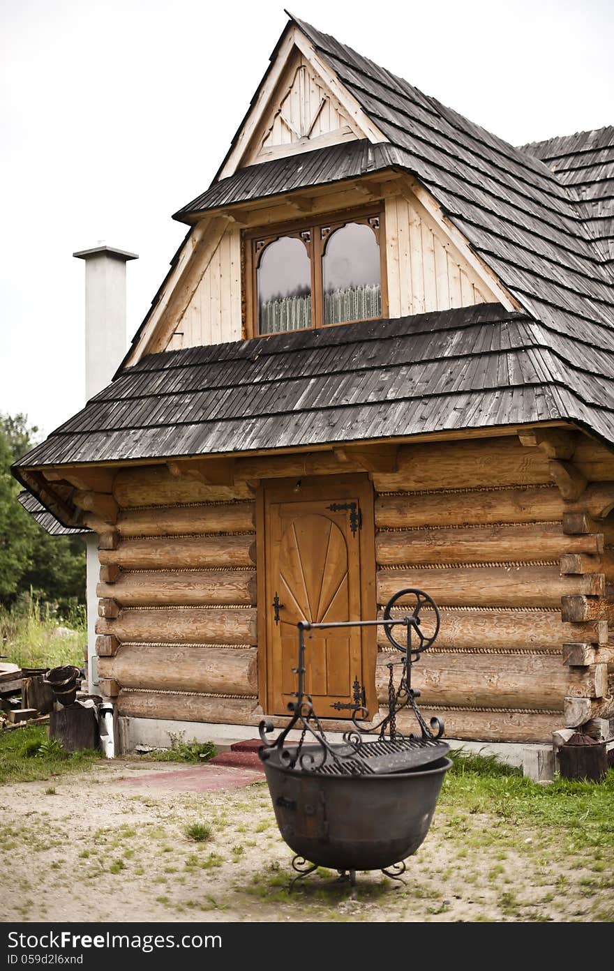 This is the mountain house common in Tatras Mountains in Poland i.e. Zakopane