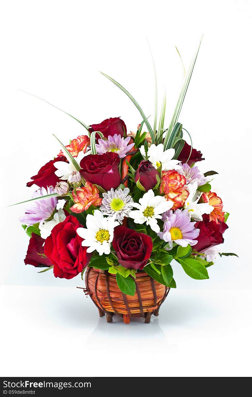 bright flowers in basket, isolated on white. bright flowers in basket, isolated on white.