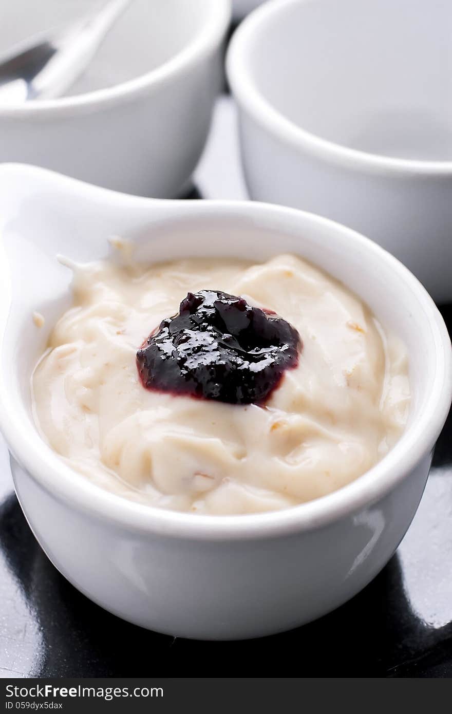 Prune yogurt with mulberry jam on top