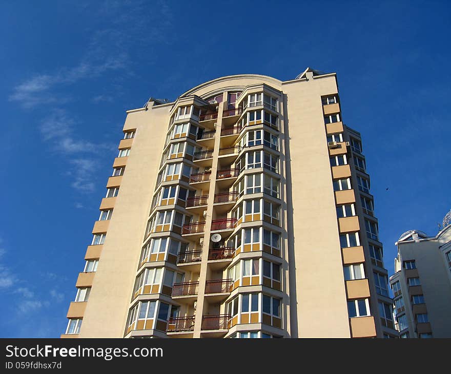 Multi-storey modern house on the blue sky background. Multi-storey modern house on the blue sky background