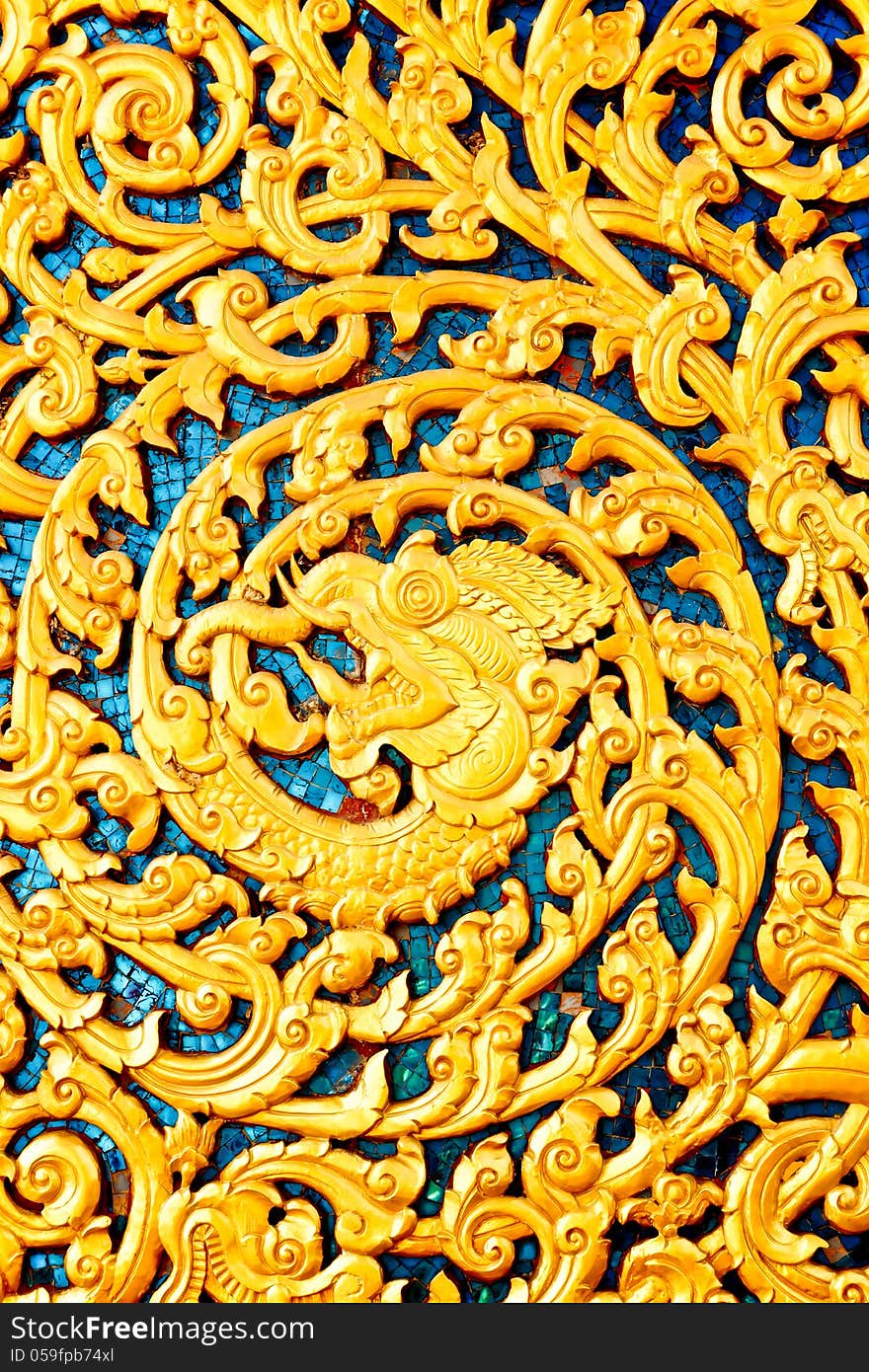 Beautiful gold wood carving with blue glass, Thai style pattern. Beautiful gold wood carving with blue glass, Thai style pattern