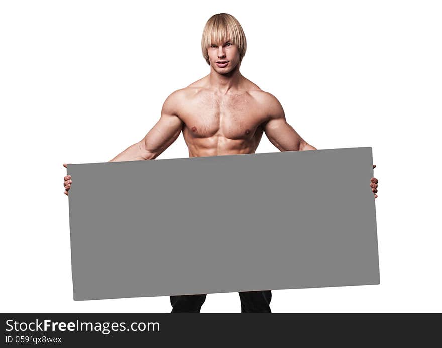 Muscled male model holding big emty card. Muscled male model holding big emty card