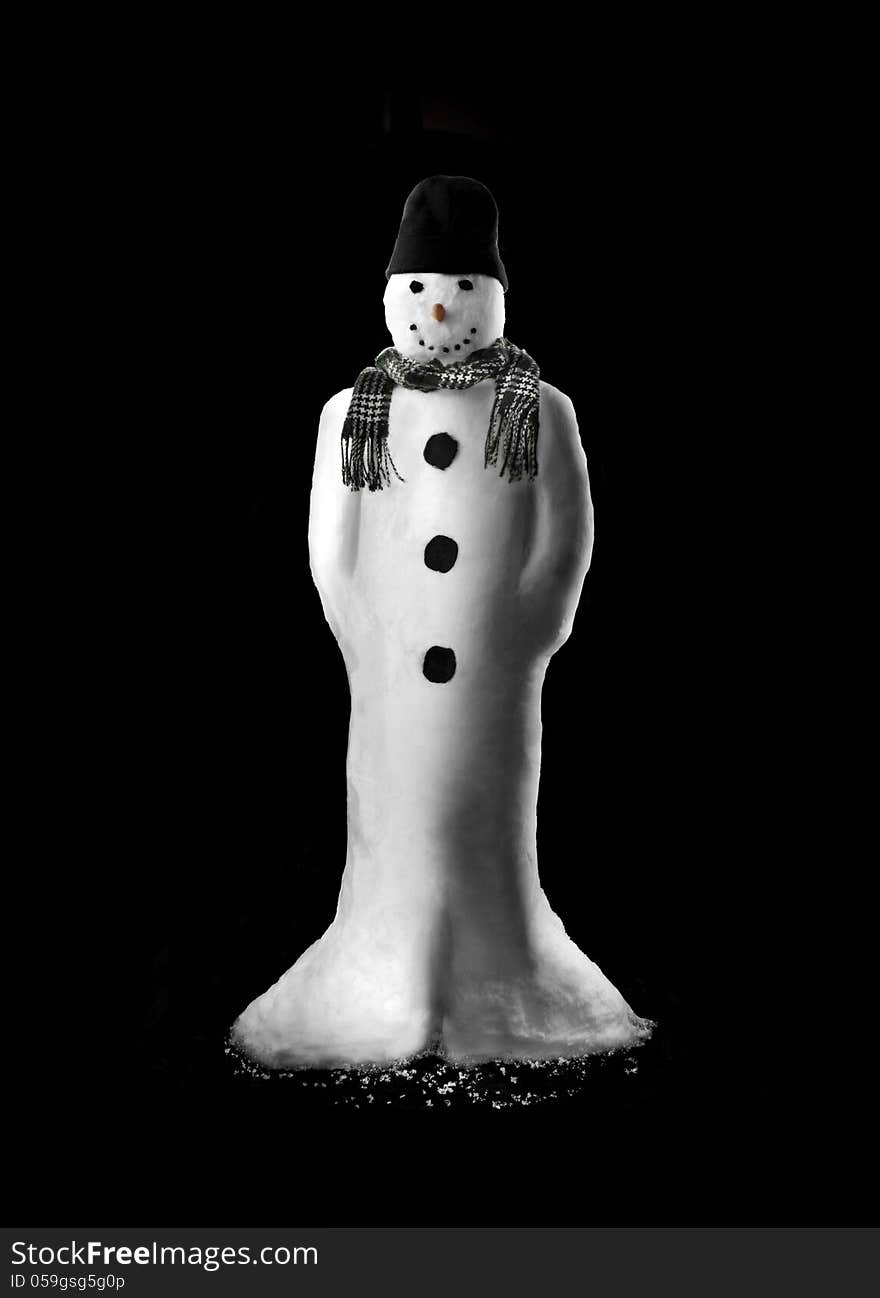 Real snowman on black background