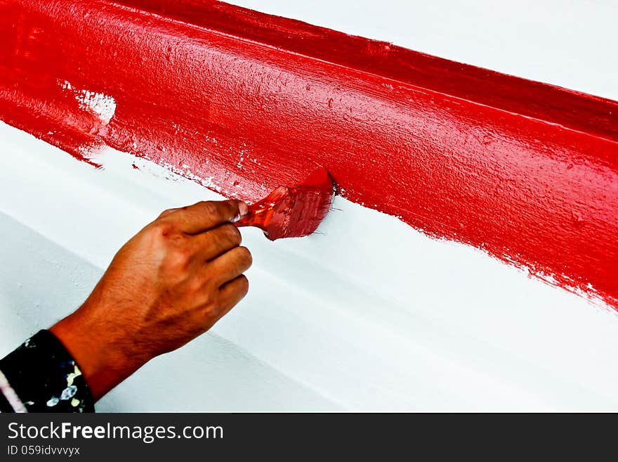 The paint brush red color by hand