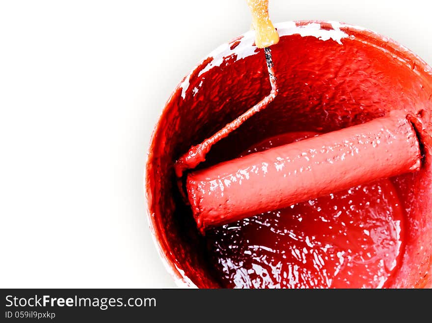 Red roller brush on a white background