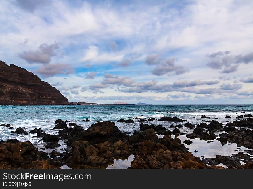 Beach of Lansarote - volcanic island , Canary, Spain. Beach of Lansarote - volcanic island , Canary, Spain