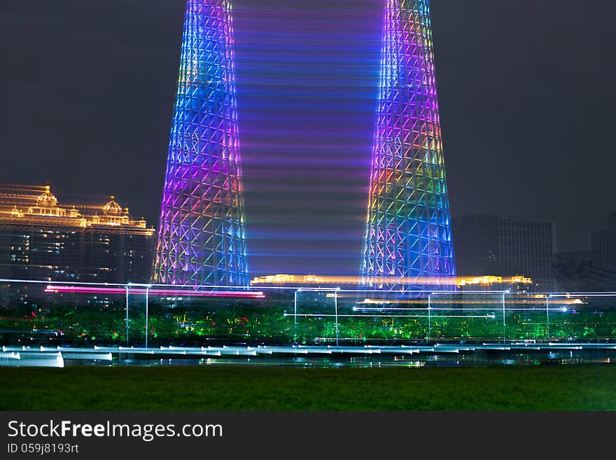 I took this photo at night with slow shutter speed (2 seconds) and the camera was seat on the tripod. During those 2 seconds, I span the tripod head slightly and then, the Two Towers appeared.