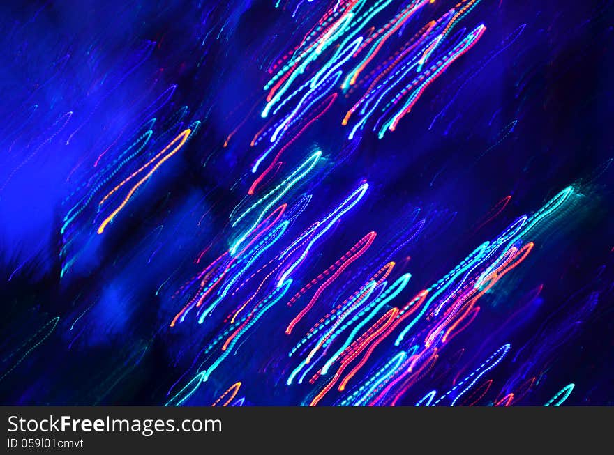 Abstract lines of lights on dark blue background