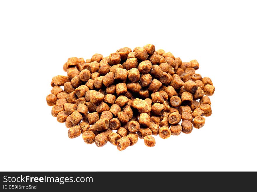 Dried pet food in pile on white background