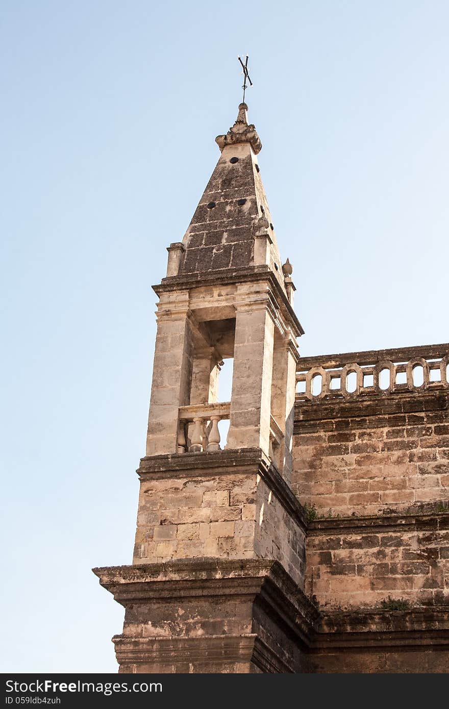 Old stone church tower in Seville Spain