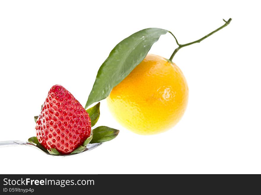 Strawberry and an orange isolated on white. Strawberry and an orange isolated on white.