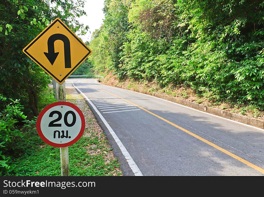 U-turn symbol Road in rustic city in Thailand