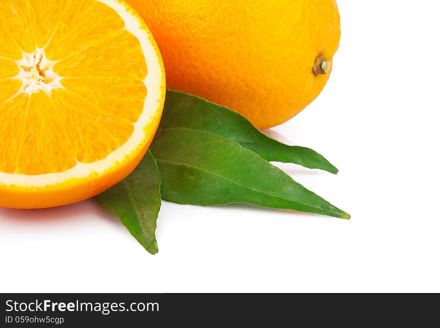 Fresh oranges fruit with green leaves,  on white background. Fresh oranges fruit with green leaves,  on white background