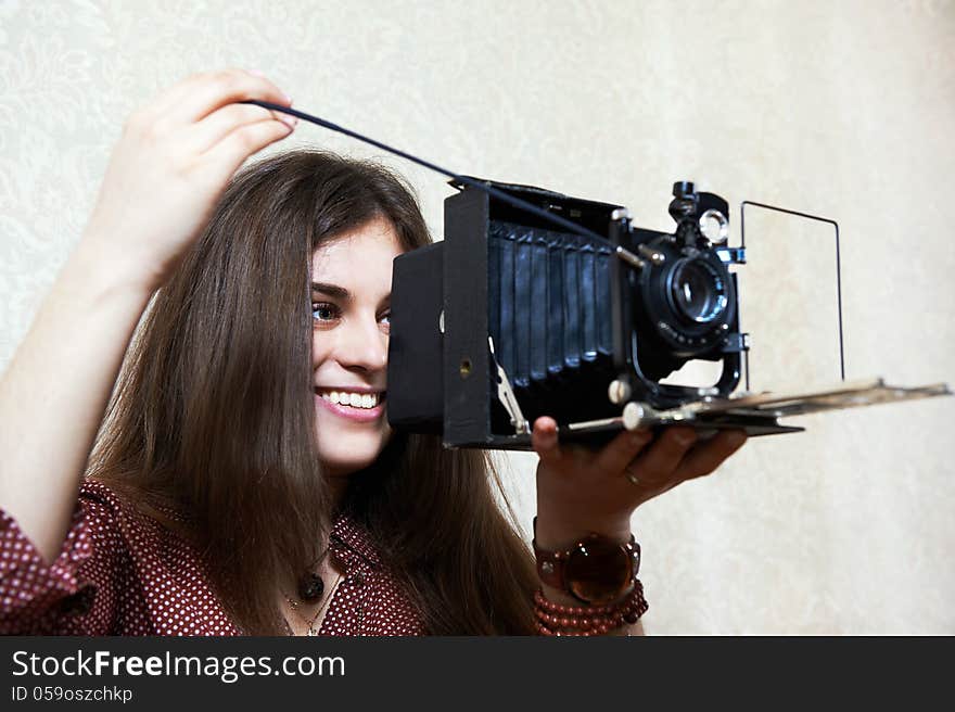 Young girl with old camera rarity