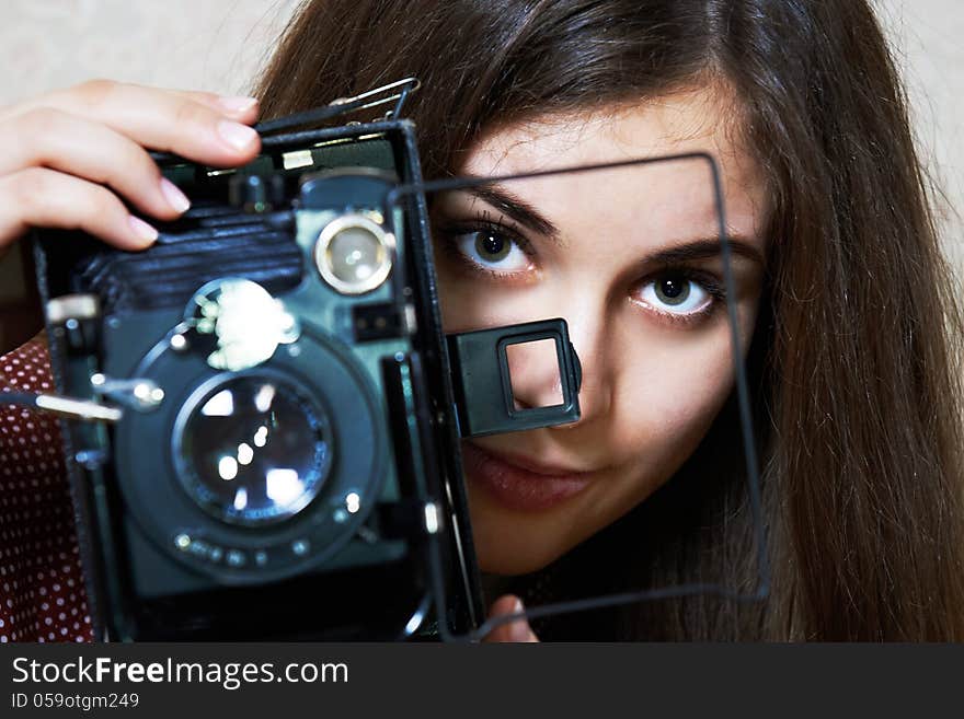 Young girl with big old camera rarity. Young girl with big old camera rarity