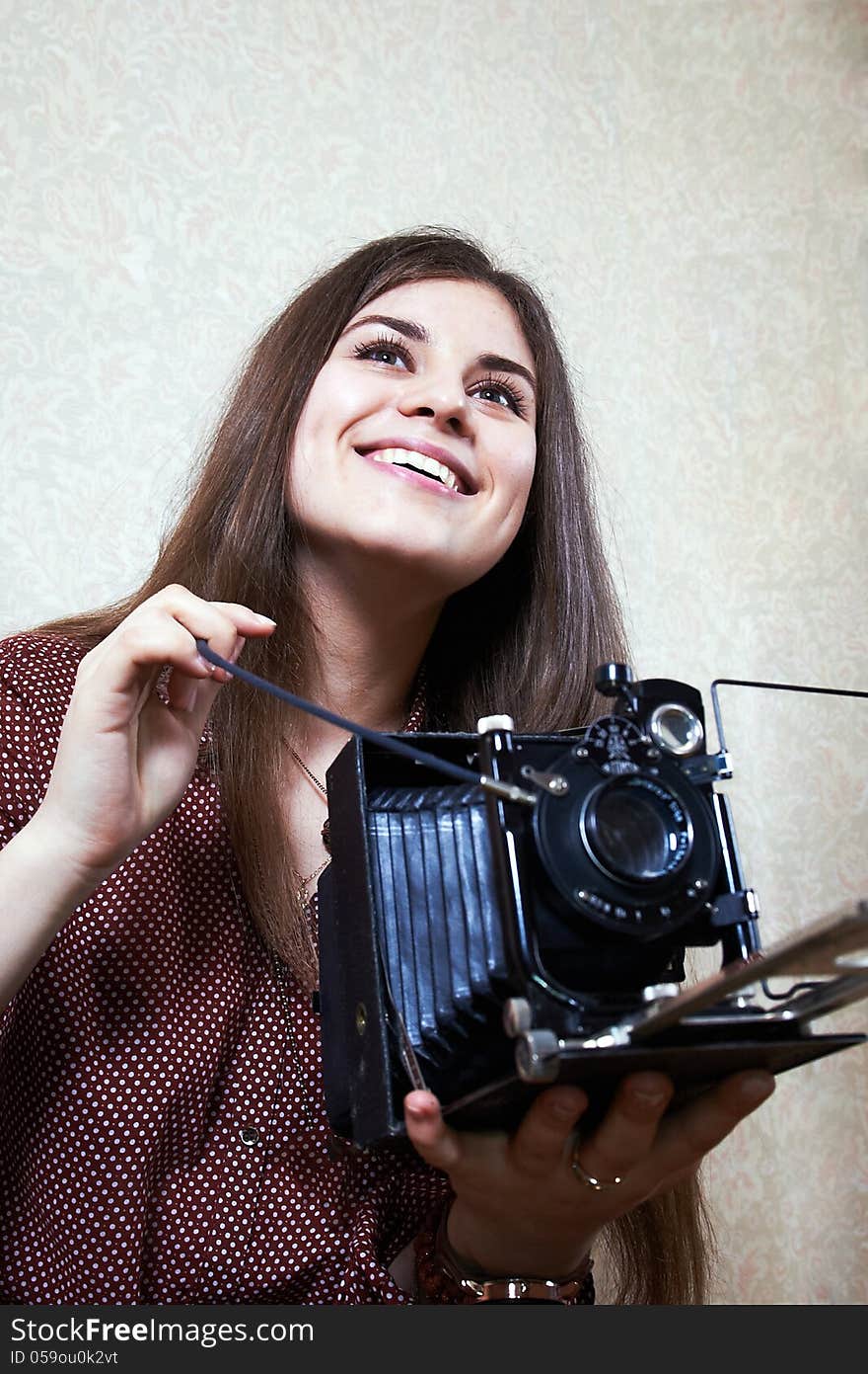 Young girl with big old camera rarity. Young girl with big old camera rarity