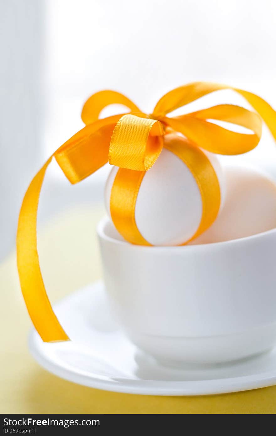 Easter eggs in white cup. Easter eggs in white cup