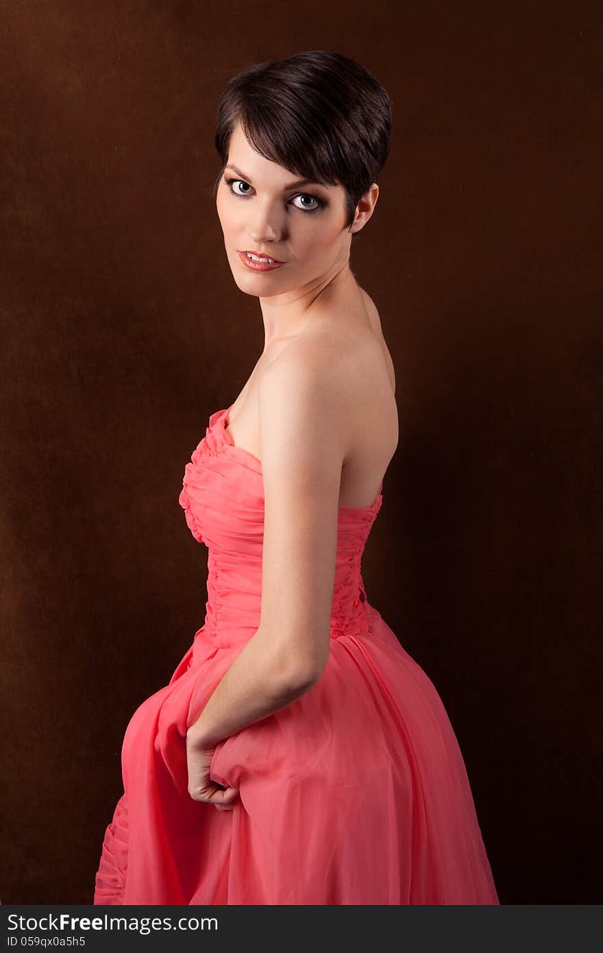 An image of a pretty model in a pink gown. An image of a pretty model in a pink gown