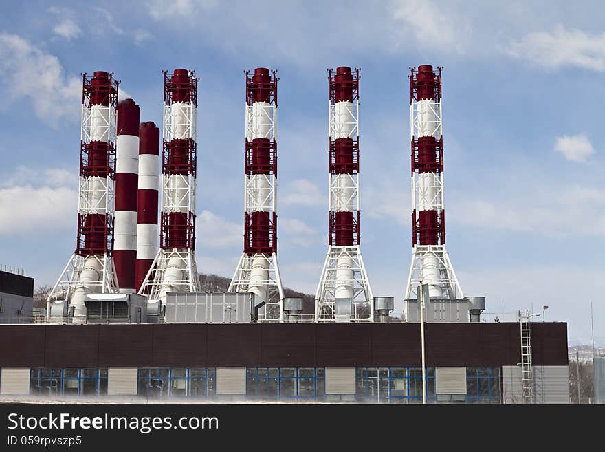 Power plant pipes against the blue sky