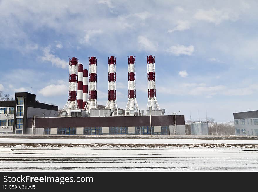 Power plant pipes against the blue sky