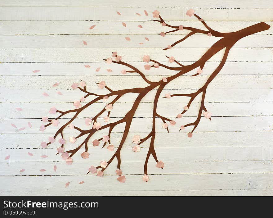 Paper cutout of tree branch on the wooden background. Paper cutout of tree branch on the wooden background