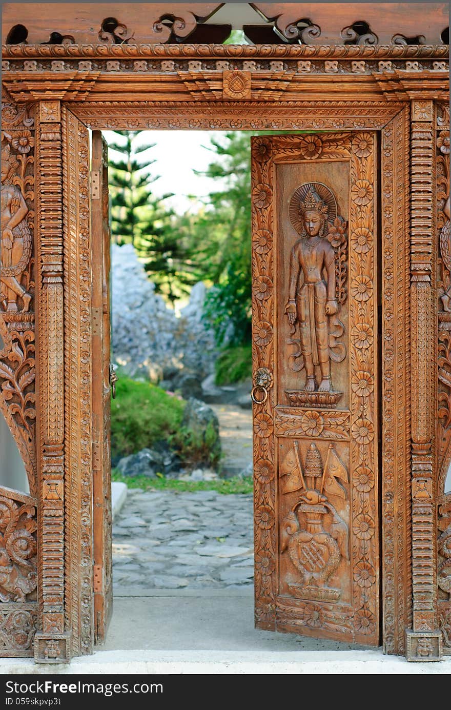 Asian carved doors. Arch on display in the park.