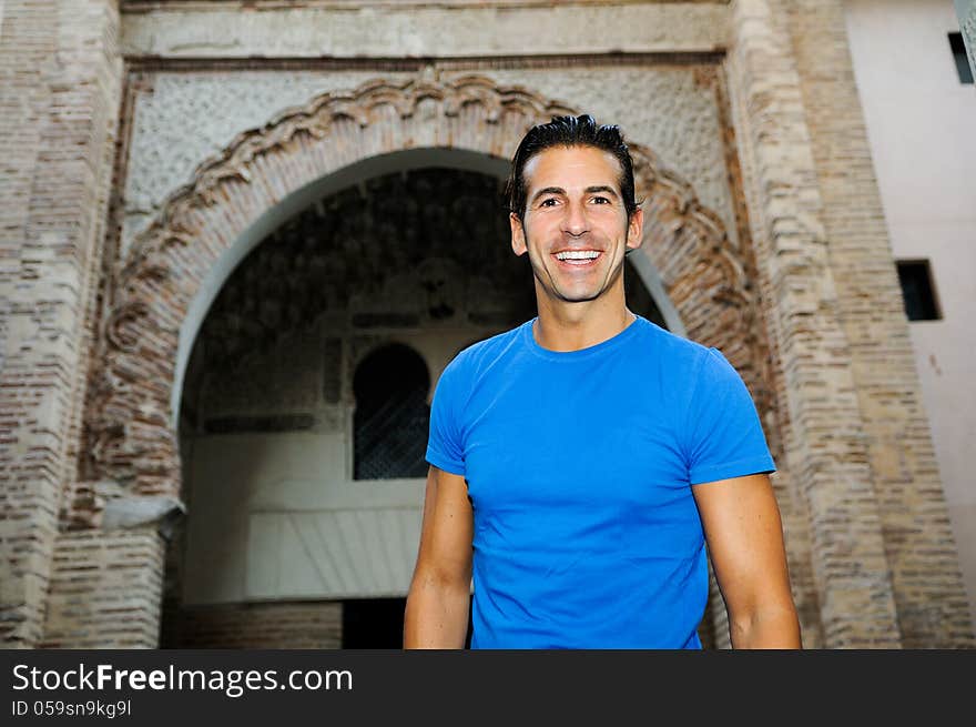 Attractive Smiling Man Portrait In Urban Background