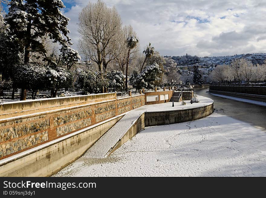 Snow storm with slush on sidewalks. Granada