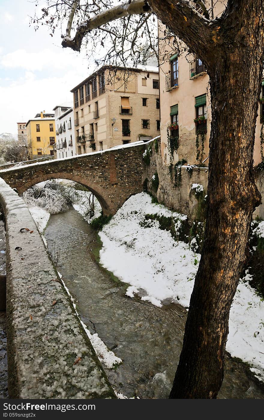 Snow storm with slush on sidewalks. Granada