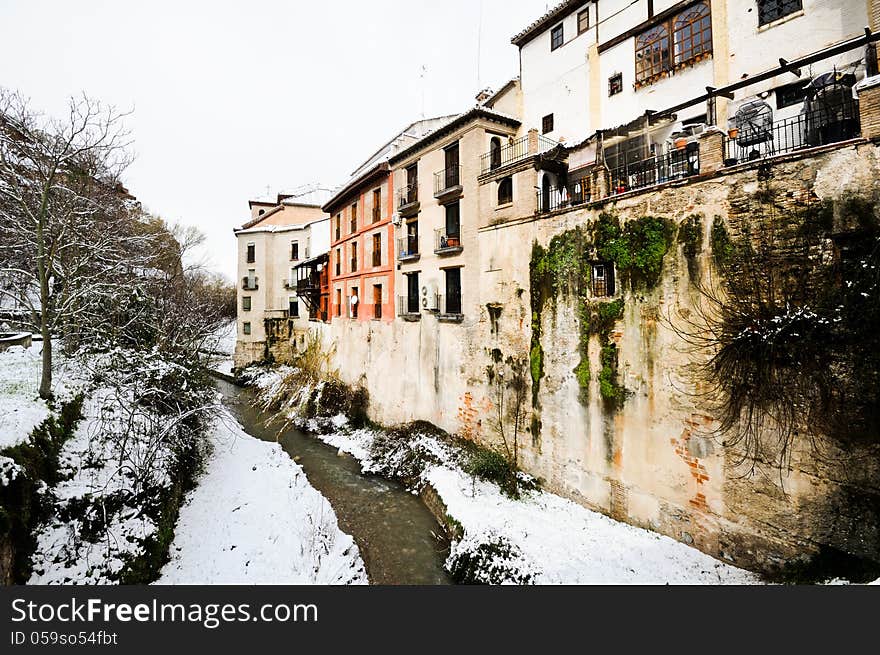 Snow storm with slush on sidewalks. Granada