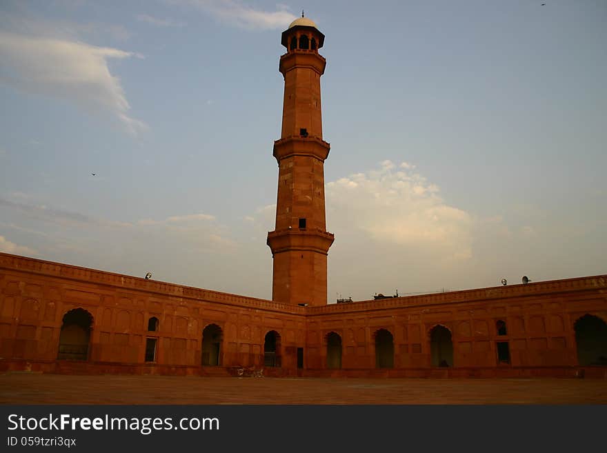 A good view of Kings Mosque one tower (in Urdu called Bashai Masjid) build by Jhanger Emperor in 16th century. Located in Lahore, Pakistan. A good view of Kings Mosque one tower (in Urdu called Bashai Masjid) build by Jhanger Emperor in 16th century. Located in Lahore, Pakistan.