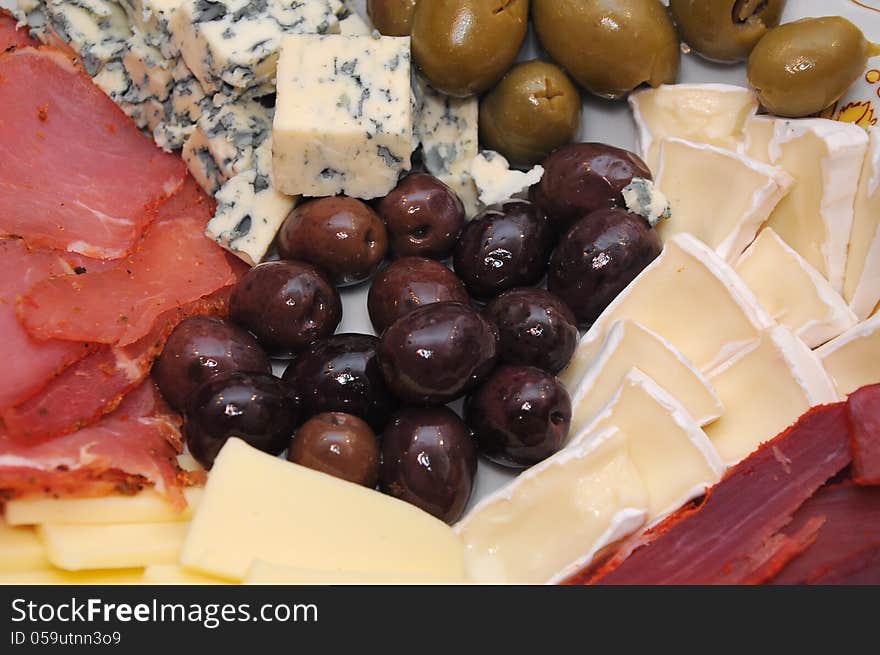 Catering food, cheese, olives and jerked meat