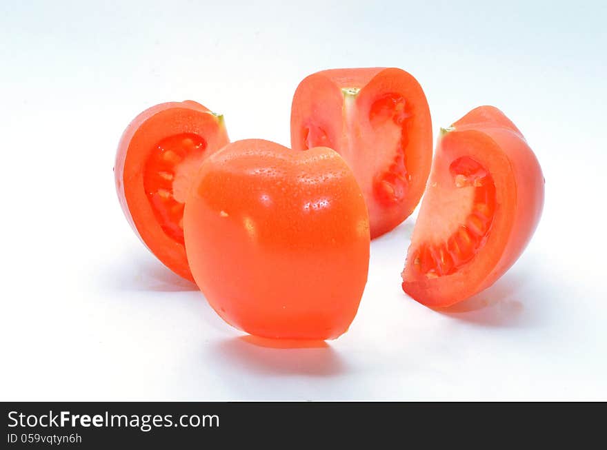 Ripe tomato is divided into four parts