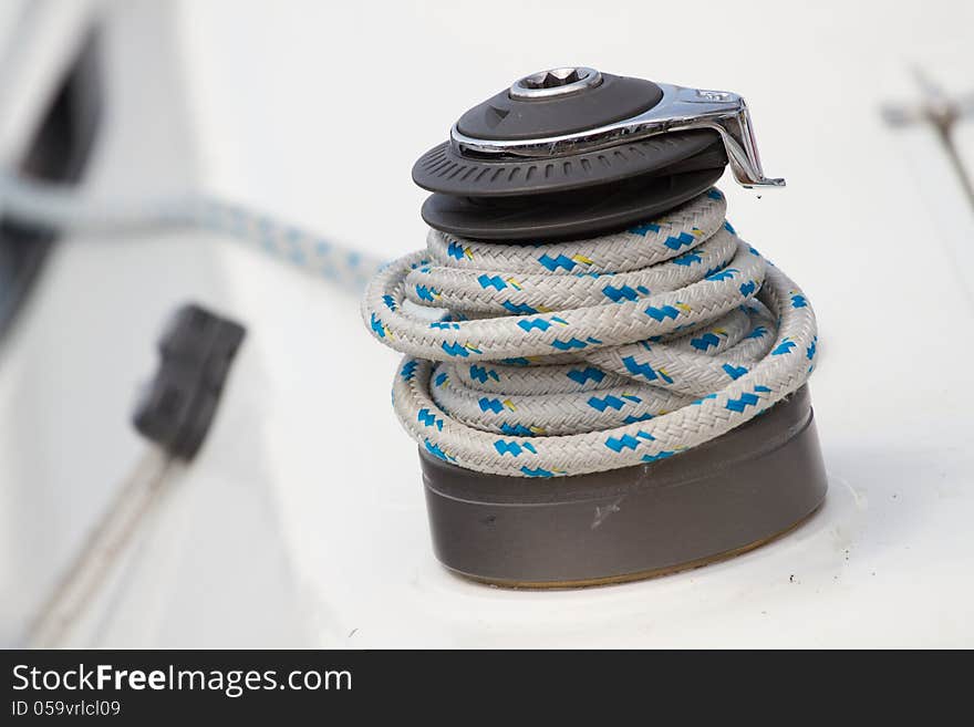 Winch and rope on a  yacht. Winch and rope on a  yacht