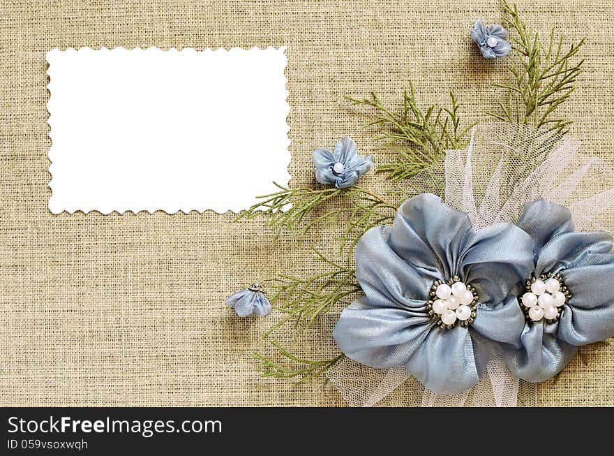 Background with a flower arrangement and a card