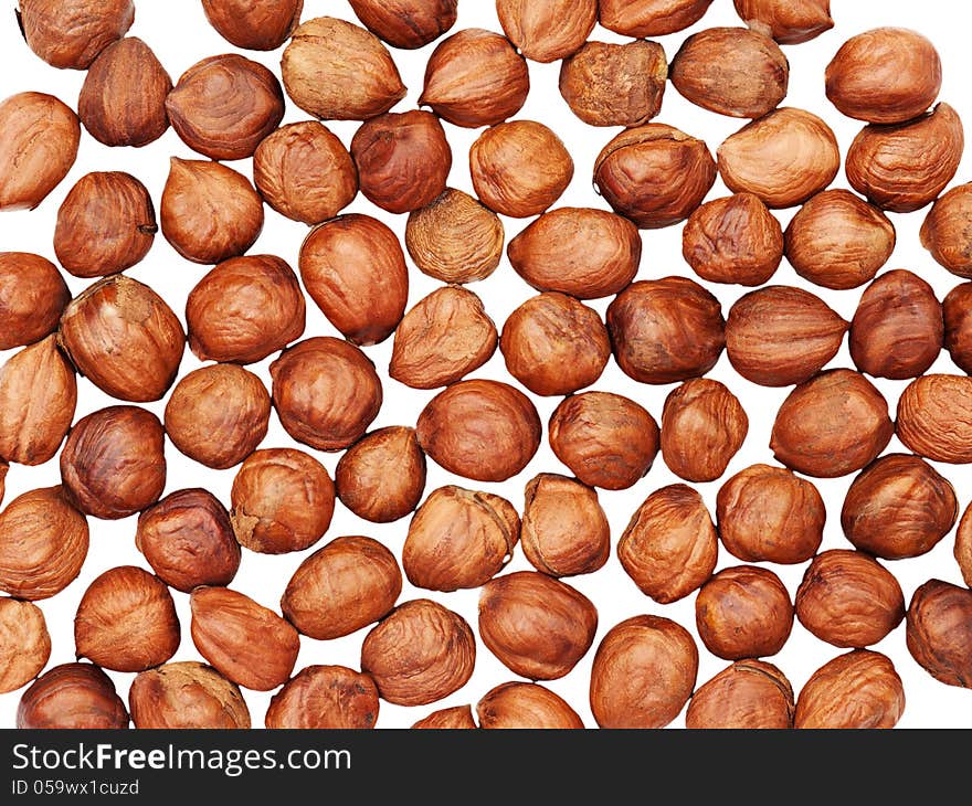 Hazelnuts background isolated on white.