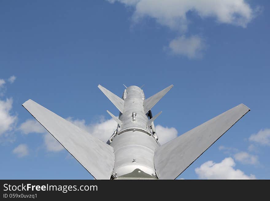 Missile aimed at the peaceful blue sky. Missile aimed at the peaceful blue sky