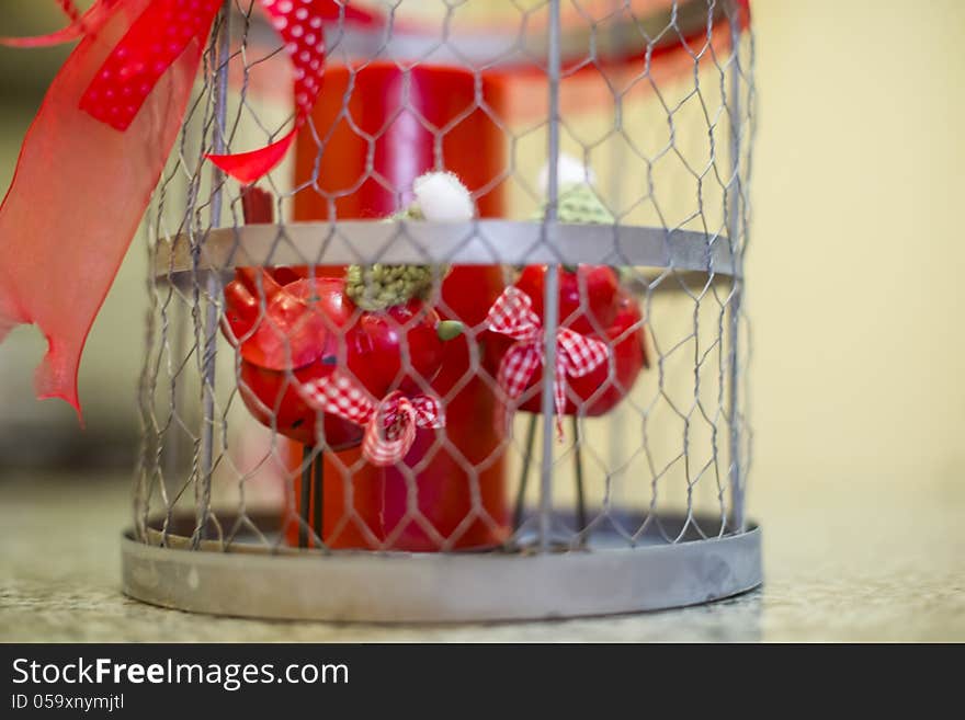 Two Small Birds In A Steel Cage Ornament