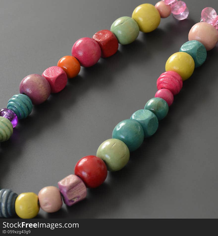 Necklace of wooden pearls with different colors