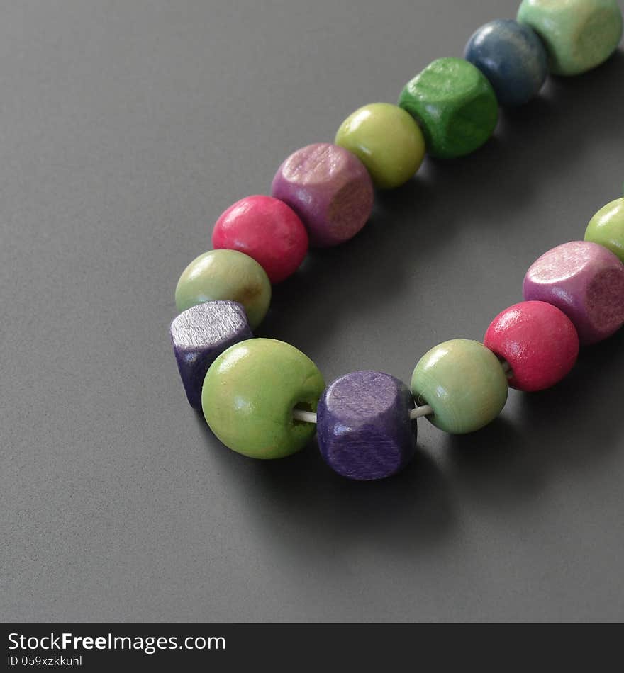 Necklace of wooden pearls with different colors