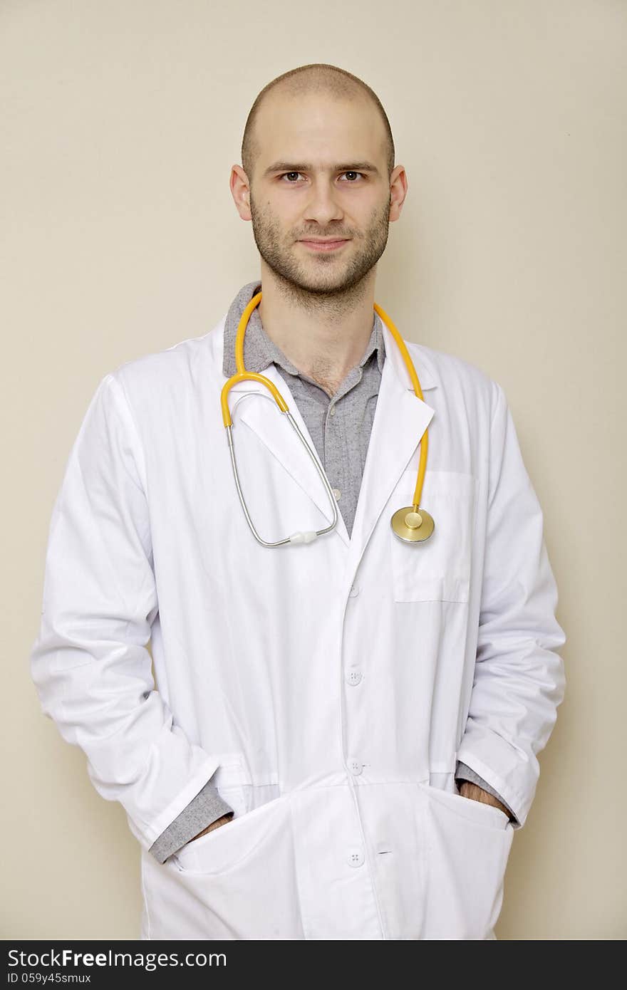 Portrait of a doctor of stethoscope isolated on light background