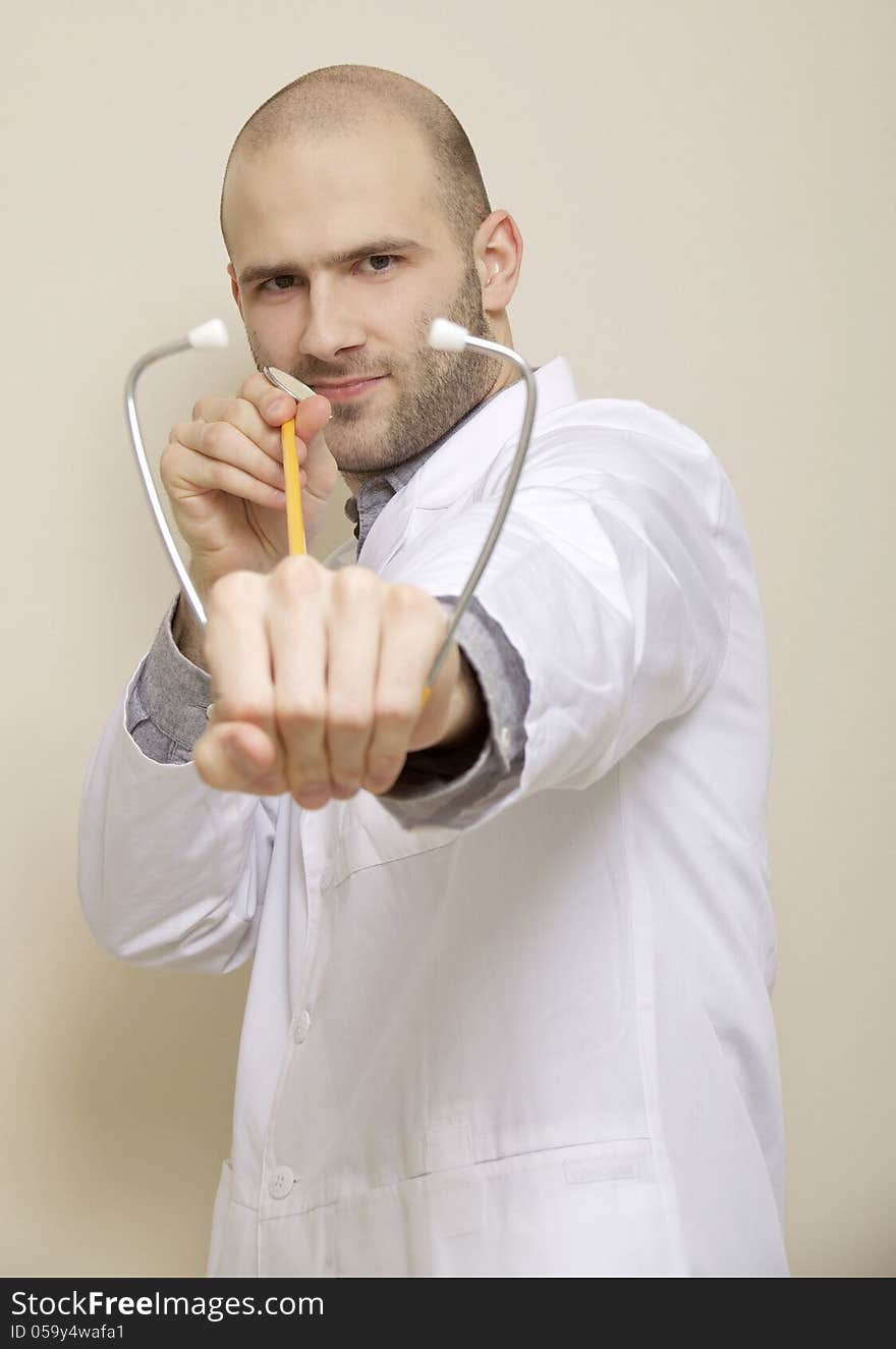 Portrait of a doctor of stethoscope isolated on light background