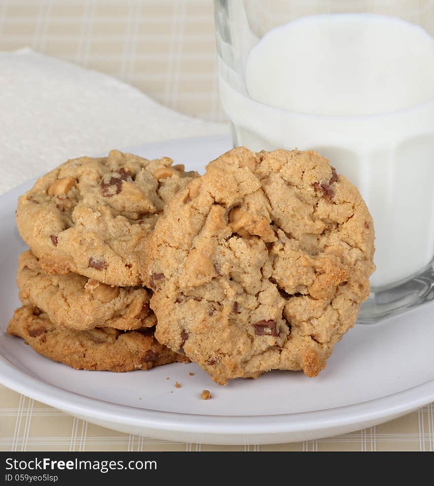 Peanut butter cookies and glass of milk on a plate. Peanut butter cookies and glass of milk on a plate