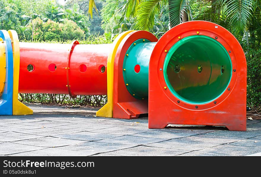 Colorful tube in playground of garden