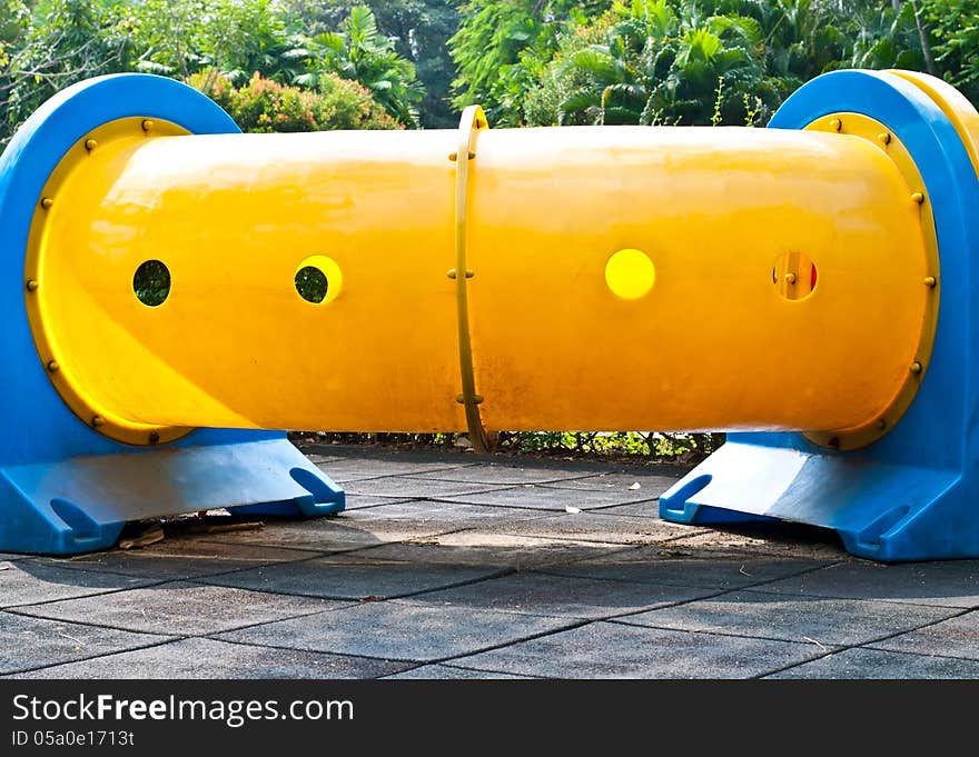 Colorful tube in playground of garden