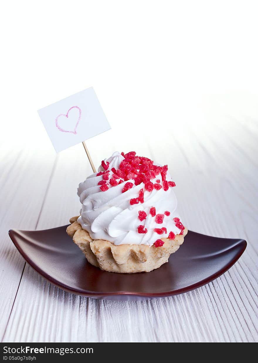 Cake with a sign for text on white background